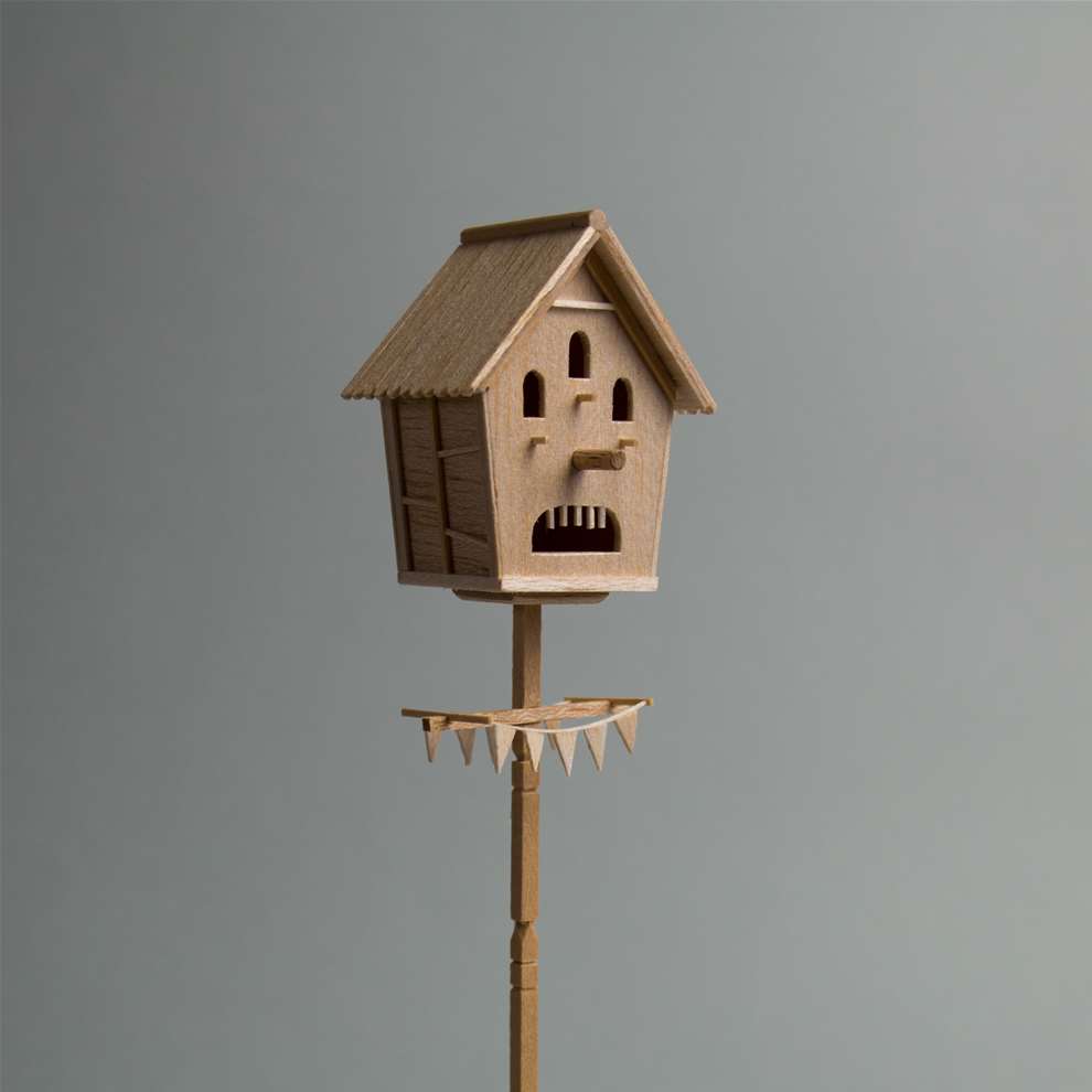 Vera Van Wolferen, Crafted wooden sculpture of a birds house with a face in.  