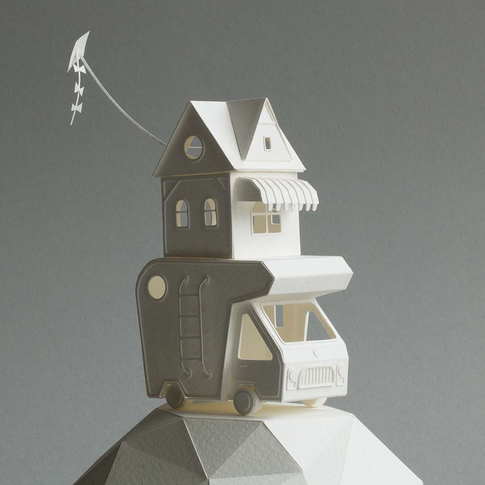 Vera Van Wolferen, Crafted intricate paper sculpture of a caravan with a house on top and flag flying from the roof.Stopmotion paper animation.
