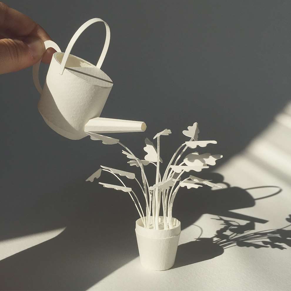 Vera Van Wolferen, Crafted intricate paper sculpture of a mini plant pot and watering can.
